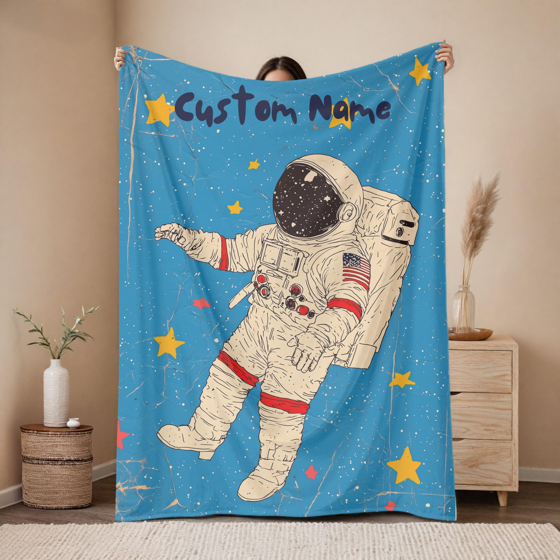 Personalized astronaut baby blanket with custom name, classic space explorer design on blue background with stars, nursery decor mockup