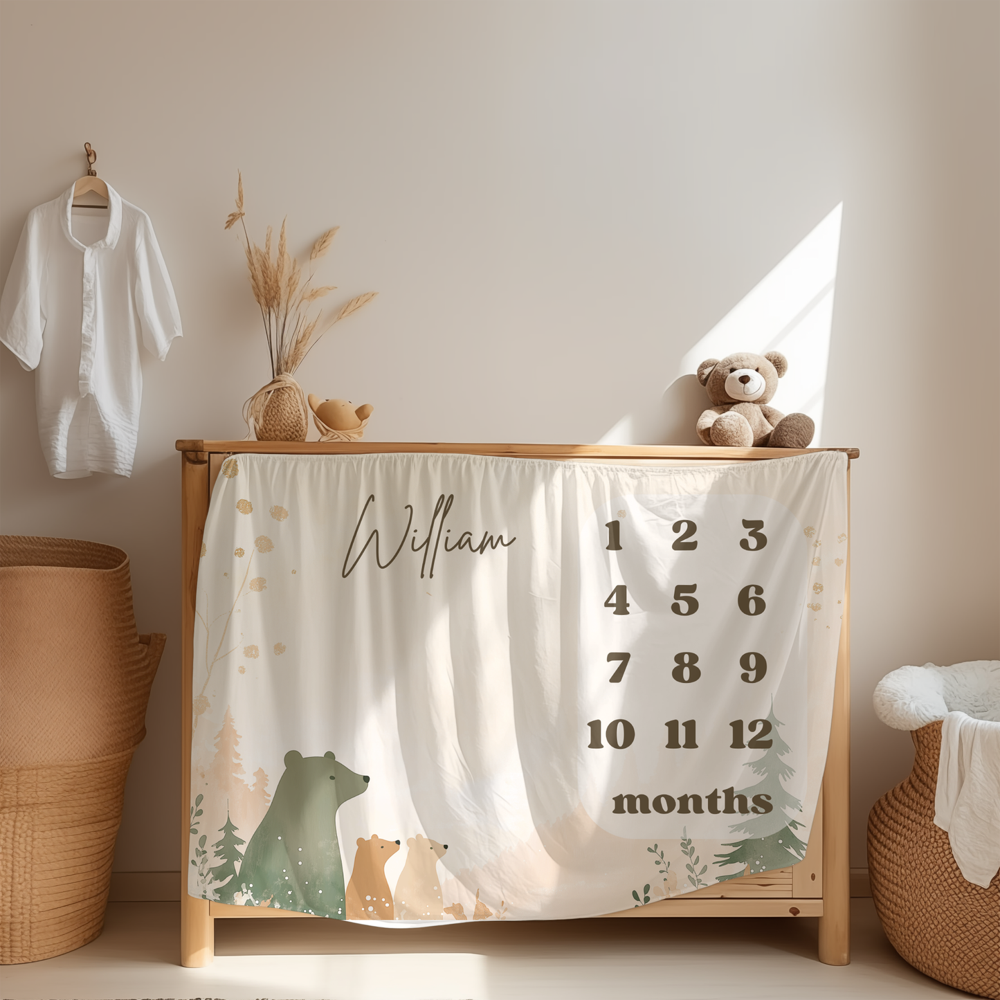 Personalized baby milestone blanket with woodland bear family design displayed in a cozy nursery room