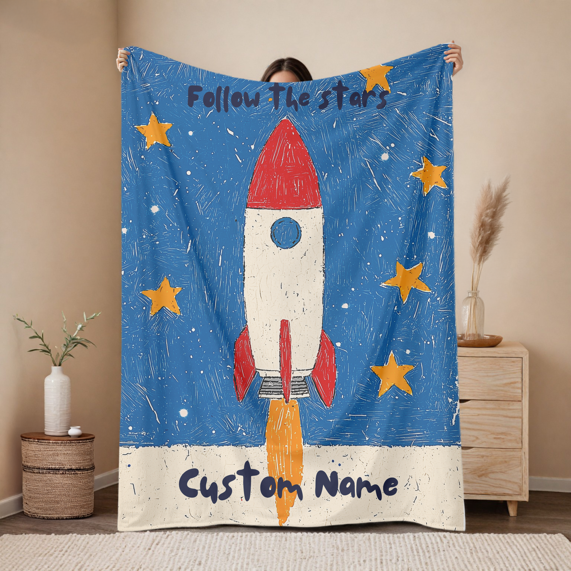 Personalized rocket baby blanket with custom name, follow the stars space design with red rocket and yellow stars on blue background, nursery decor mockup