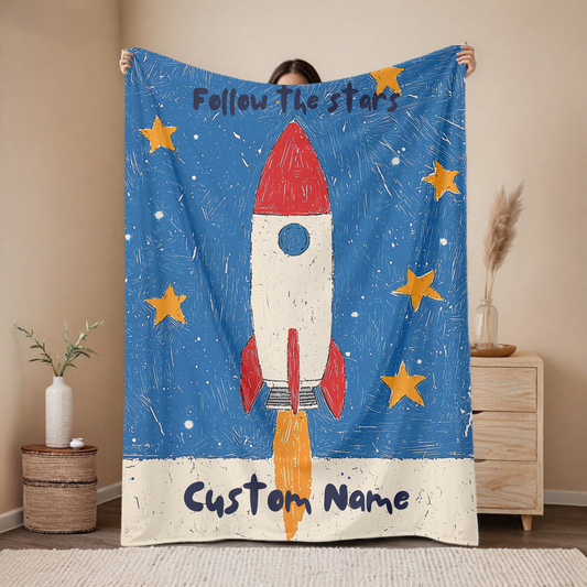 Personalized rocket baby blanket with custom name, follow the stars space design with red rocket and yellow stars on blue background, nursery decor mockup
