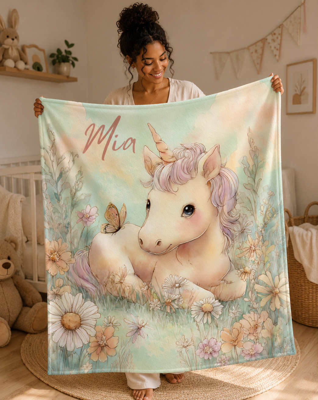 Woman holding personalized unicorn baby blanket with custom name, wildflower meadow design